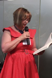 Me reading a scene from Shatterwing (photo by Cat Sparks)