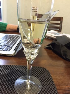 A writer drinking champagne
